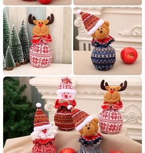 Detail of Christmas drawstring gift bags featuring 3D Santa, Snowman and Reindeer dolls