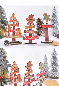 Detailed view of three mini wooden Christmas tabletop decorations with gingerbread motifs
