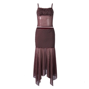 Detailed view of dark red polka dot mesh two-piece set with crop top and irregular skirt