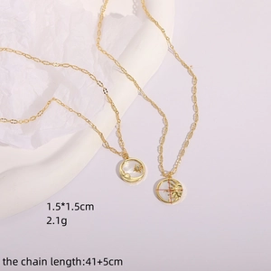 14K gold plated sun and moon necklace set with sparkling starburst cubic zirconia