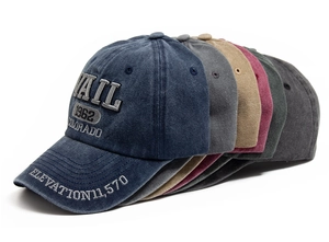 Detailed close-up of vintage washed cotton baseball caps with VAIL 1962 embroidery