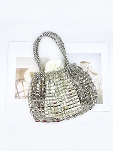 Silver woven metal paillette handbag featuring an ivory satin drawstring inner pouch