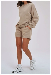 Detail view of khaki cotton loungewear set with sweatshirt and drawstring shorts