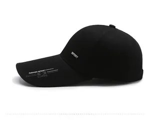 Detailed side view of black sports baseball cap with white fashion text embroidery