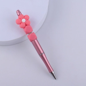 Pink DIY beaded ballpoint pen featuring creative flower and silicone bead decorations