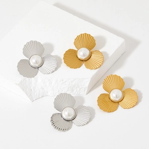 Elegant floral pearl stud earrings in gold and silver finish on minimalist white bases