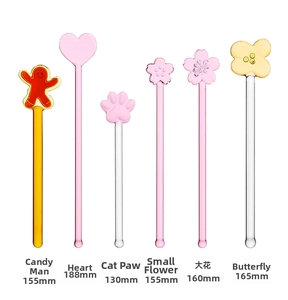 Detailed view of heat-resistant glass stir sticks in cherry blossom and heart shapes