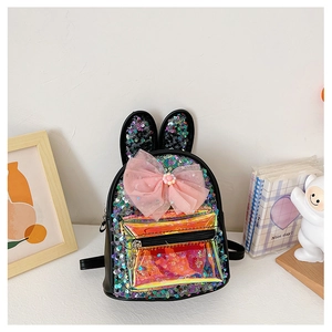 Detail of colorful sequins, long rabbit ears and large pink mesh bow on kids backpack