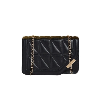 Elegant black quilted shoulder bag with gold chain strap and metallic detail
