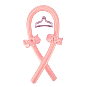 Detailed set of pink silk heatless hair curlers with matching scrunchies and a claw clip