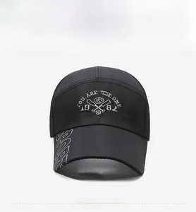 Close-up of black baseball cap featuring white 1982 embroidery and sport visor detail