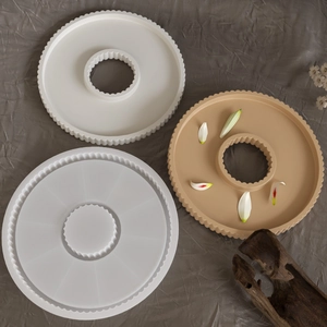 Detailed view of round silicone molds with striped texture for plaster resin casting