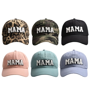 Six assorted MAMA baseball caps with chenille patches in leopard, camo, and solid colors