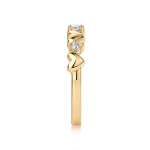Macro side view of gold S925 silver heart ring with sparkling round moissanite stones