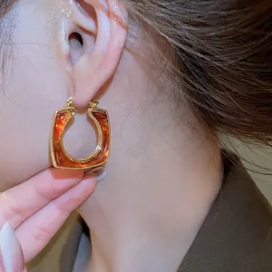 Vintage 18k gold plated resin square hoop earrings shown on model for women
