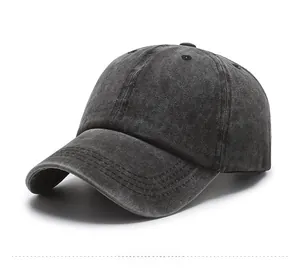 Detail of washed grey denim baseball cap showing distressed texture and breathable eyelets