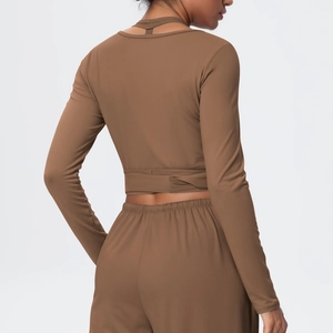 Back view of brown V-neck sports set with cross straps and hollow out detail