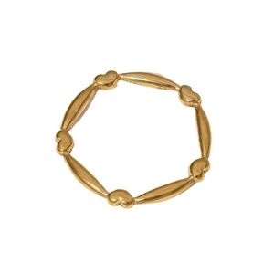 Minimalist gold heart link ring made of stainless steel displayed on a white background