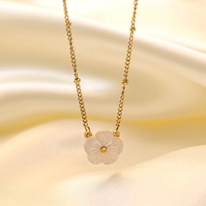Elegant 18K gold-plated titanium necklace with a white shell peach blossom flower pendant