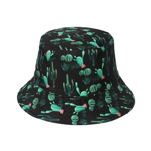 Black reversible bucket hat with green cactus and pink flower patterns on white background