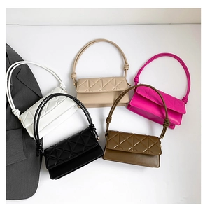 Flat lay of small square crossbody bags in five colors with quilted PU leather texture