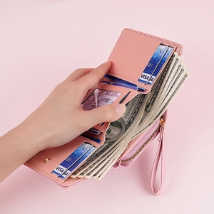 Pink PU leather short bifold wallet with card slots, zipper pocket and wrist strap