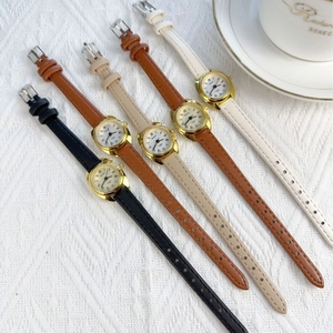 Elegant women's quartz watches with leather straps in multi-colors and golden cases