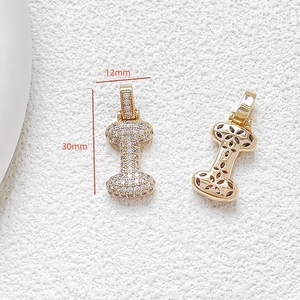 Macro view of a 30mm gold letter I pendant with zircons and hollow-out back design