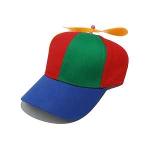 Detail of the colorful rainbow baseball cap with a spinning yellow propeller on top