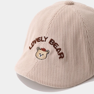 Beige corduroy beret for toddlers with lovely bear embroidery and button top detail