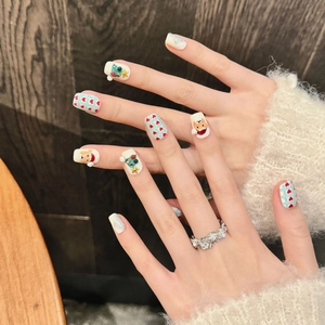 Hand-painted Christmas reindeer press-on nails with 3D tree and glitter patterns
