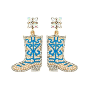 Detail of cowboy boot earrings with blue enamel, gold trim and white faux pearls