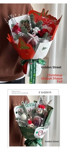 Close-up of Christmas wrapping film with Merry Christmas gold foil prints and green ribbon