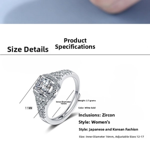 Close-up detail of women's adjustable white gold ring with square sparkling zircon
