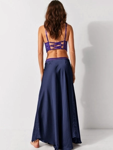 Rear view of elegant navy satin midi skirt with purple lace splicing detail