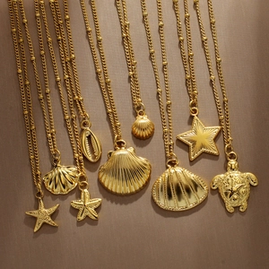 Gold ocean themed shell and starfish pendant necklaces with elegant beaded chains