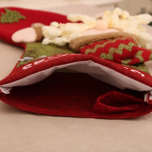 Detailed view of the linen Christmas stocking interior with Merry Christmas text