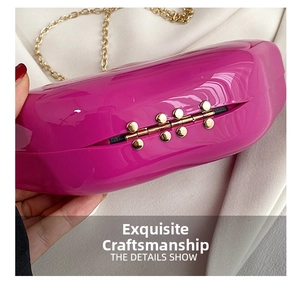 Macro shot of rose pink hard shell box bag showing gold hinges and fine craftsmanship