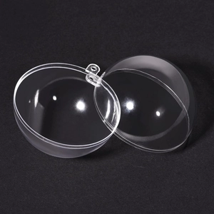 Detail of transparent fillable plastic ornament ball with hanging loop for DIY crafts