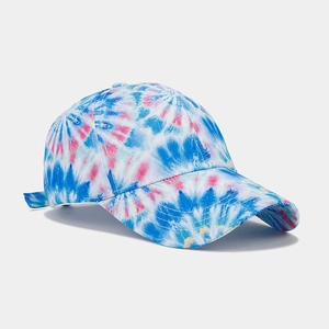 Detail of blue and pink tie-dye cotton baseball cap with curved brim and twill texture