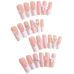 Pink and white French gradient press-on nails with 3D rose and bow jewelry accents