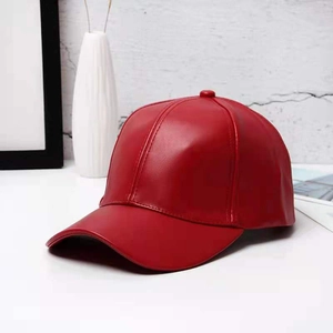 Detailed view of the red PU leather baseball cap showing high-quality grain and stitching