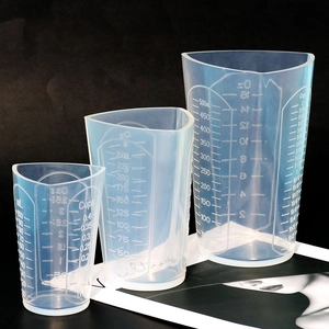 Three sizes of translucent silicone measuring cups with ml, oz, and cup scales