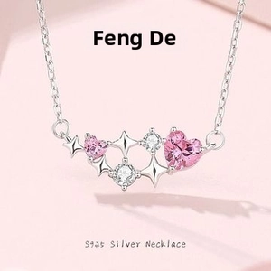 Detailed close-up of S925 silver necklace with pink heart gem and star-shaped zirconias