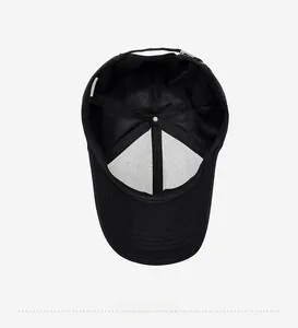 Detail view of black cotton baseball cap interior showing lining and metal buckle