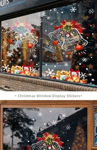 Detail of Christmas window stickers featuring red bells, snowflakes, and Merry Christmas text