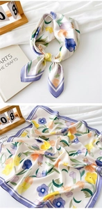 Detailed close-up of tulip floral pattern and purple border on silk square scarf