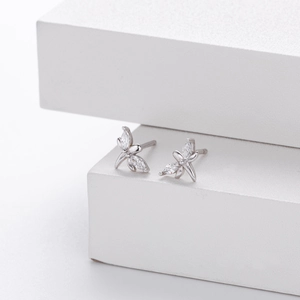 Detailed macro view of S925 sterling silver dragonfly stud earrings with marquise-cut zircons
