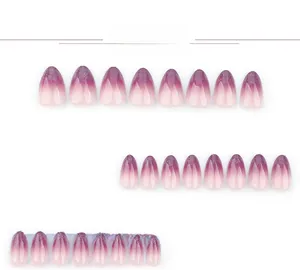 Macro detail of almond-shaped purple gradient fake nails with glitter tips set of 24 pieces