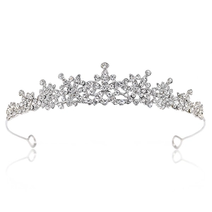 Elegant silver tiara with sparkling rhinestones and floral star patterns on white background
